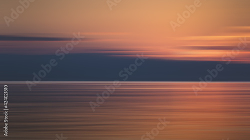 Abstract motion blur landscape sunset over the sea of Poetto beach