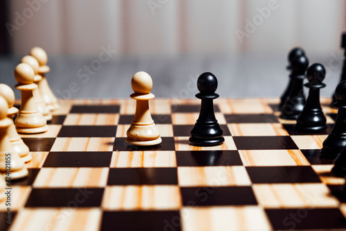 Two pawns  one white and one black  starting chess game