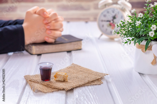 Young woman praying and Taking communion