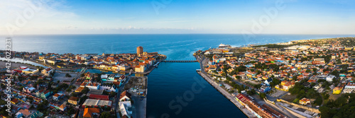 Bild auf Leinwand Panoramic aerial view above Downtown Willemstad, Curacao, Caribbean with ocean
