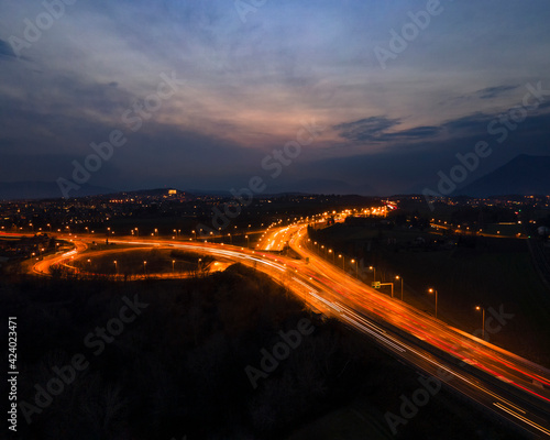 long exposure aerial view of the highway with traffic during busy hour at sunset © Andrea