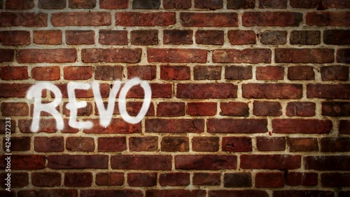 Wallpaper Mural Revolution spray painted on the brick wall. Graffiti art concept message. Airbrush hand paint. City abstract artwork. Torontodigital.ca
