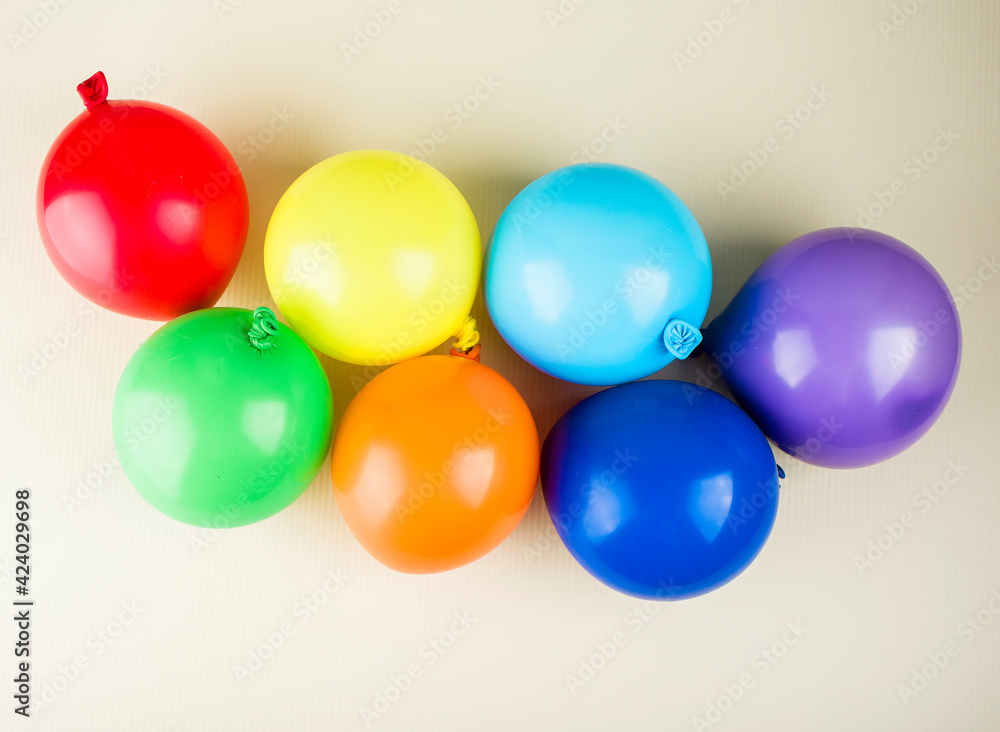 Small multicolored inflatable balls in the rainbow palette, art concept, holiday content. Colorful balloons Small multicolored inflatable balls in the rainbow palette, art concept, holiday content. Colorful balloons