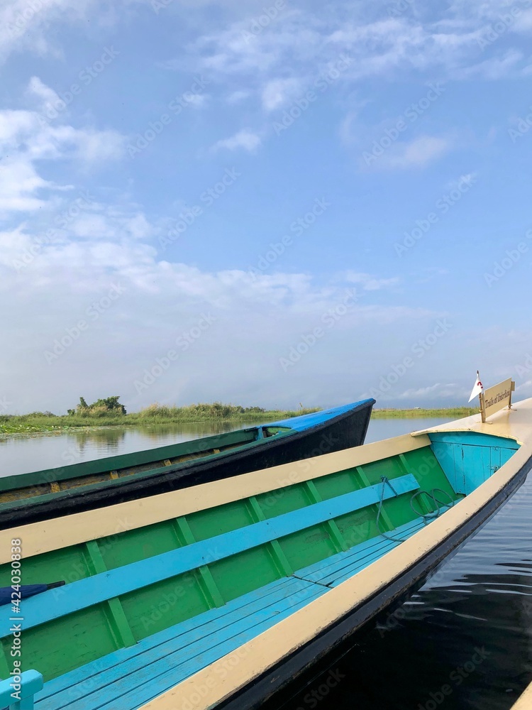 Inle Lake, Myanmar - November 9, 2019: Boat navigating through floating gardens in Inle Lake