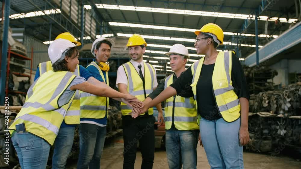 Engineering people are Hand coordination in heavy factory industry , engineering teamwork , business people working concept Engineering people are Hand coordination in heavy factory industry , engineering teamwork , business people working concept