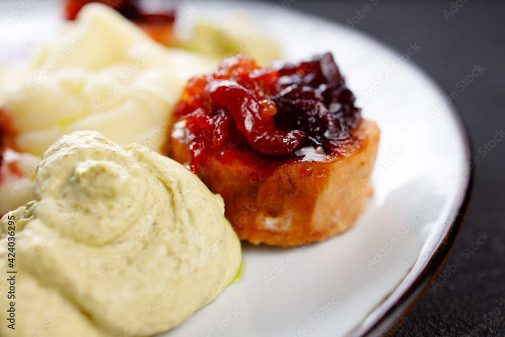 Salmon medallions with mashed potatoes and sauce Salmon medallions with mashed potatoes and sauce