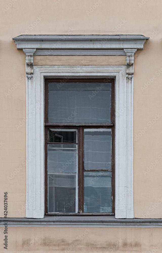 Windows in the city in the old style, with stucco, decorative elements Windows in the city in the old style, with stucco, decorative elements