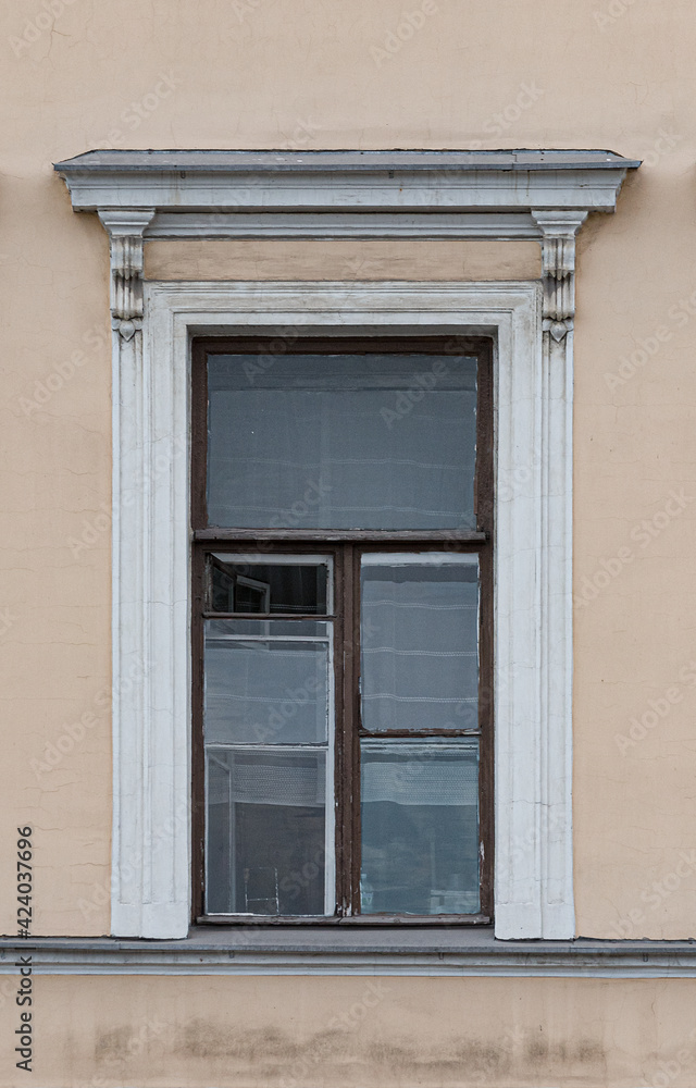  Windows in the city in the old style, with stucco, decorative elements