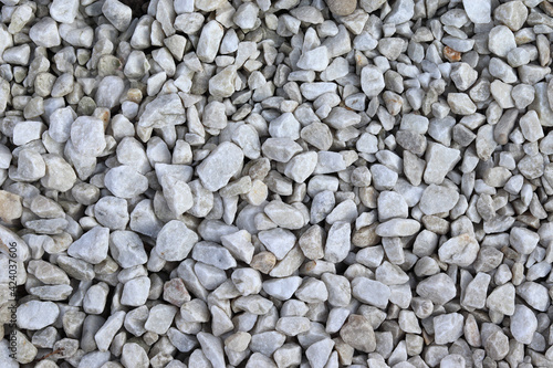 Gray gravel background - small stones. Stone aggregate