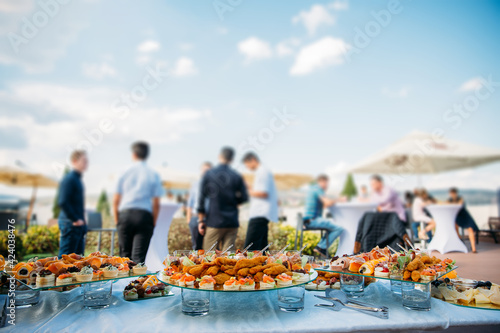 Canvas Print Aperitifs at a rooftop party.