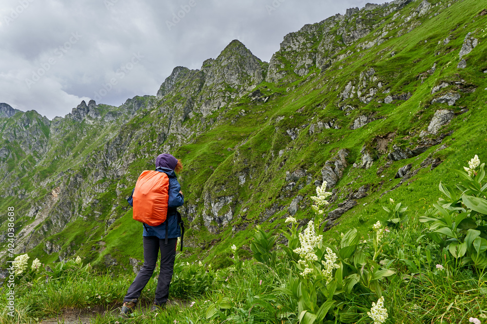 Woman hiking in a rainy day Woman hiking in a rainy day