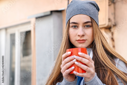 Portrait of smiling beautiful with cup of coffee, relaxing outdoor