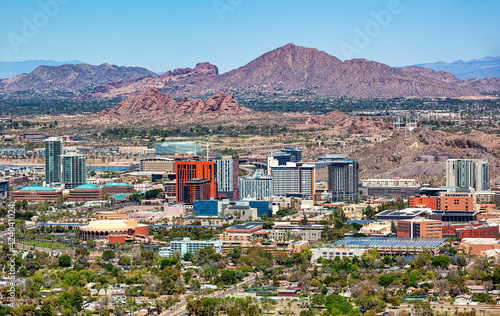 Aerial view of a Growing Tempe, Arizona Skyline with Camelback Mountain in the distance photo