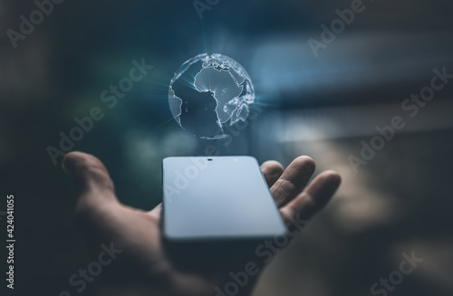 Earth hologram above smartphone screen