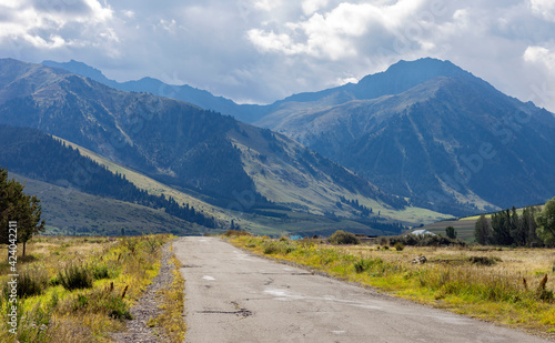 View of an old paved road in a mountainous area in Central Asia.
