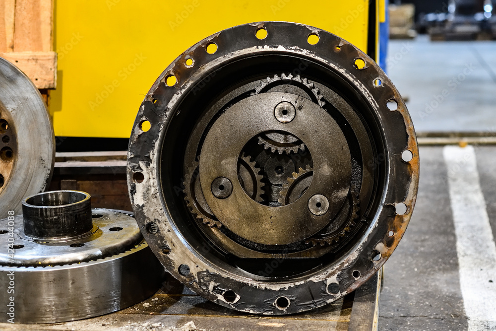 Gear wheels in a workshop for the repair of mechanical equipment. Gear wheels in a workshop for the repair of mechanical equipment.