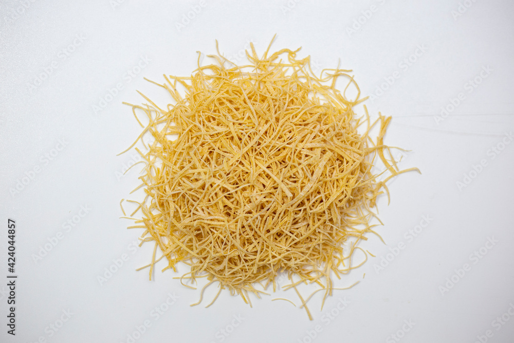 Homemade noodles on a white background.