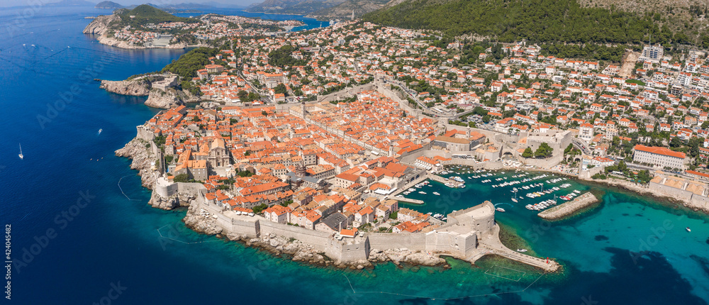 Aerial panorama drone shot of Old Port in Dubrovnik old town in Croatia summer midday noon