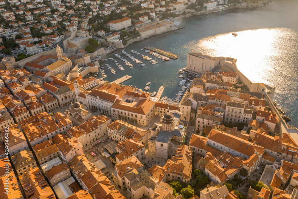 Obraz premium Aerial drone shot of Dubrovnik old town port in sunrise sun light in Croatia summer