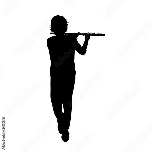 Silhouette teenage boy playing flute.