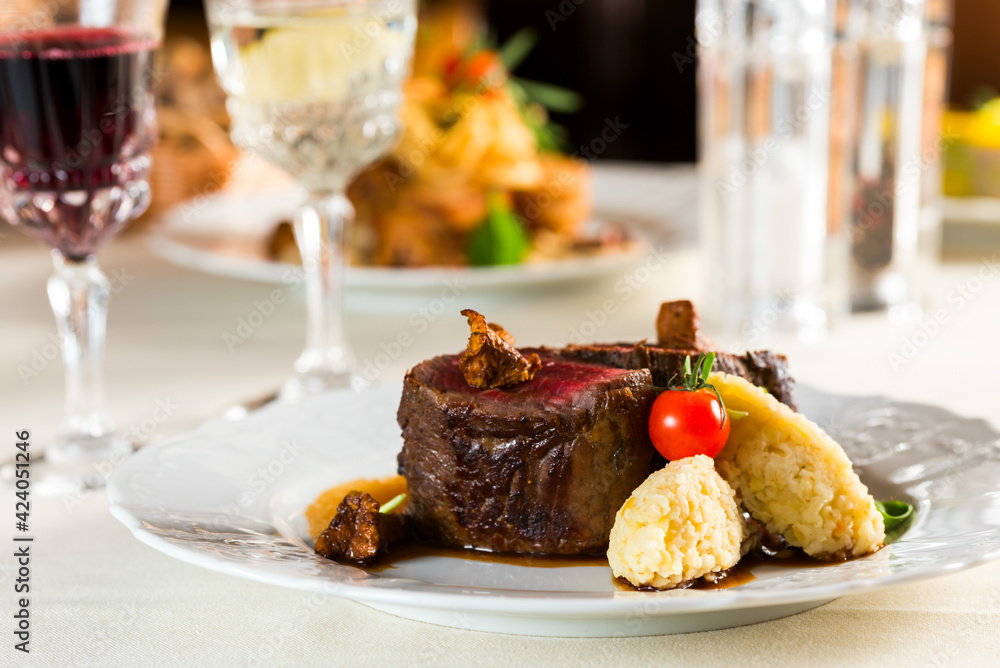 beautiful fried medium fried steak with porridge garnish and fried chanterelle and pmidora mushroom decorations beautiful fried medium fried steak with porridge garnish and fried chanterelle and pmidora mushroom decorations