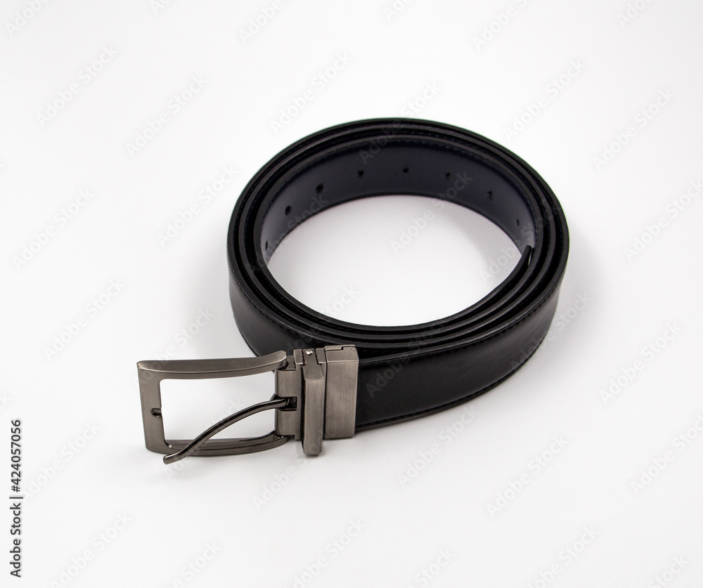Obraz premium Black belt for pants, on a white background.