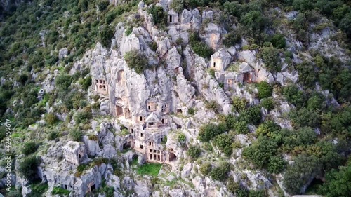 High angle drone aerial view of ancient greek rock cut lykian empire amphitheatre and tombs in Myra (Demre, Turkey)
