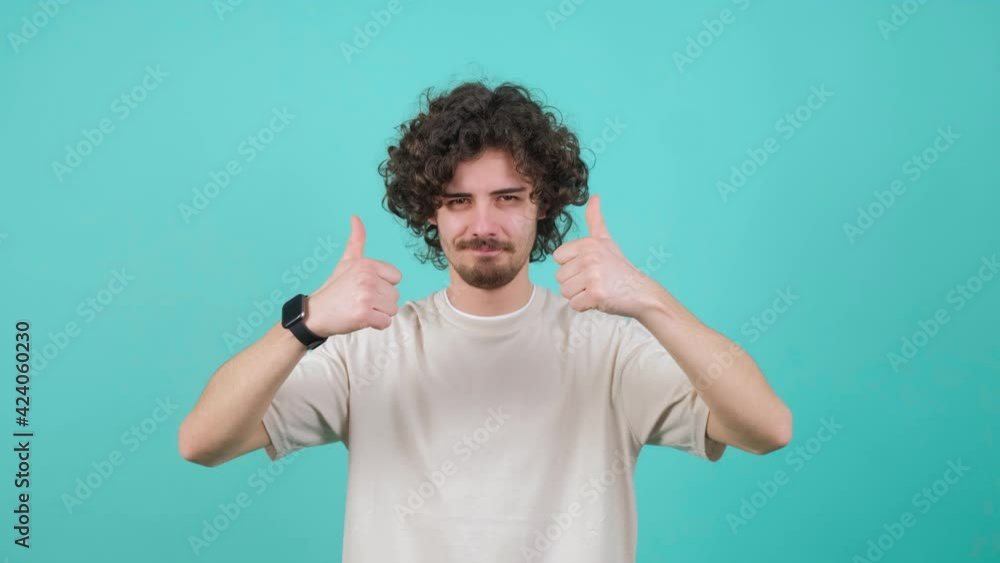 Positive guy pointing down, saying to subscribe, gesturing ok and like. Positive guy pointing down, saying to subscribe, gesturing ok and like.