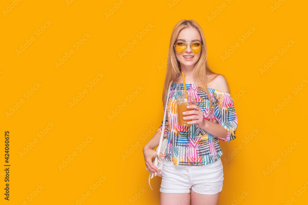 Stylish young woman with drink in summertime Stylish young woman with drink in summertime