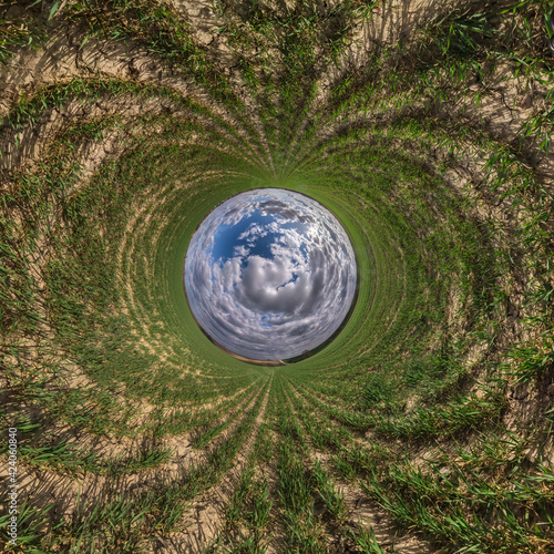 Blue little planet. Inversion of tiny planet transformation of spherical panorama 360 degrees. Spherical abstract aerial view. Curvature of space.