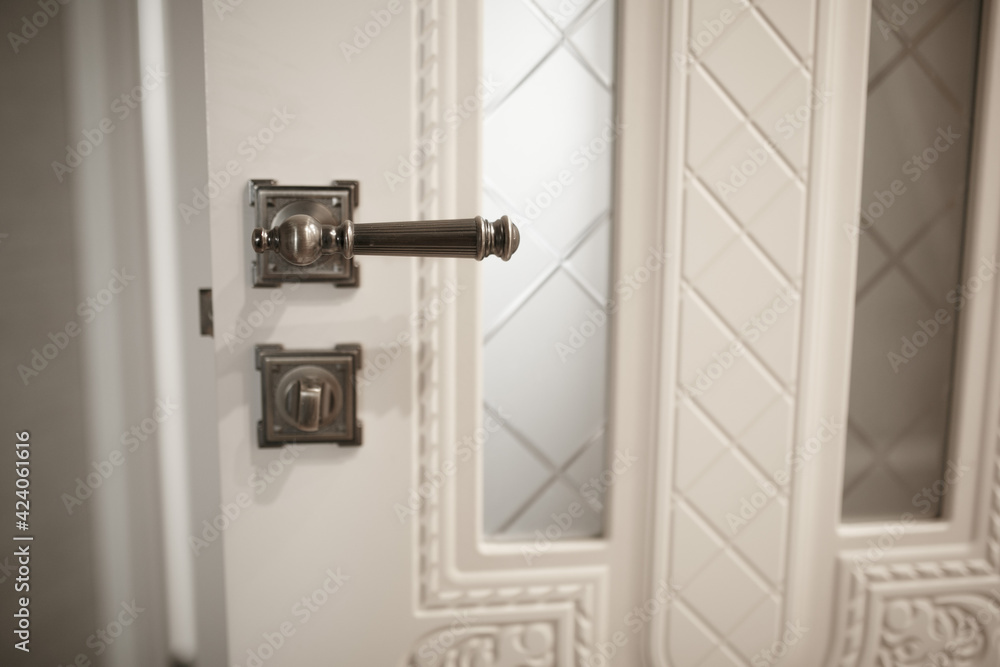 The handle on the room door.