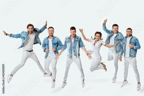 crazy men and woman in denim t-shirt jeans jumping high