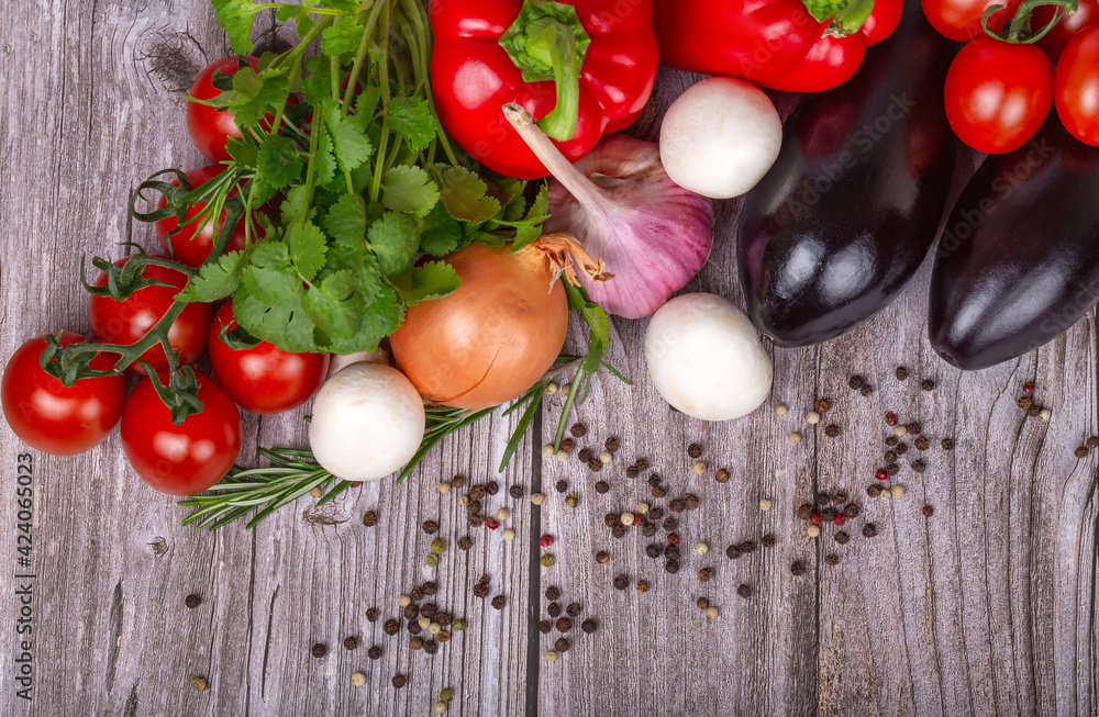 heap of bright ripe vegetables on grey table heap of bright ripe vegetables on grey table