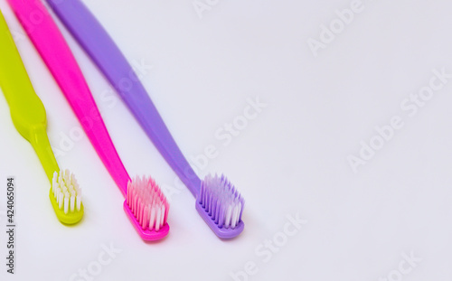 Toothbrushes dental care family set. Two toothbrushes for adults, one for child.