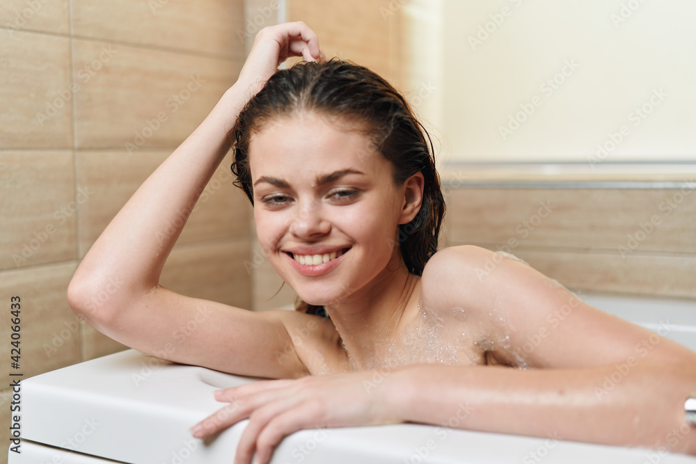 cheerful woman lies in the bathroom hygiene clean skin relaxation cheerful woman lies in the bathroom hygiene clean skin relaxation