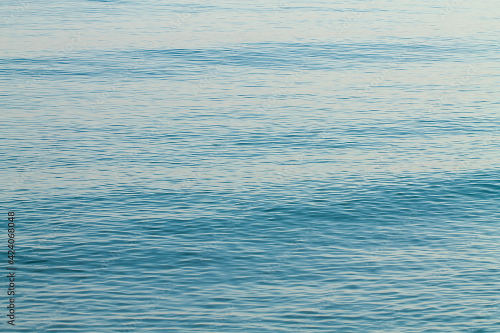 Sea water blue surface with ripples. Abstraction. Sea water blue surface with ripples. Abstraction.