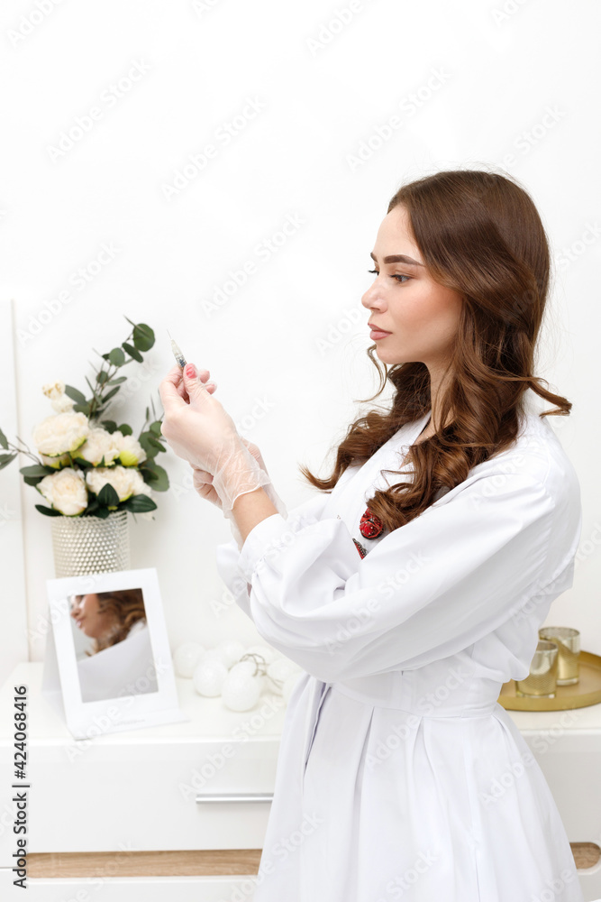 female beautician with a syringe in rubber gloves female beautician with a syringe in rubber gloves