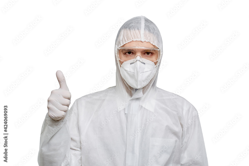 The face of the doctor in chemical protection and a mask shows a thumbs-up gesture, like. White isolated background. The face of the doctor in chemical protection and a mask shows a thumbs-up gesture, like. White isolated background.
