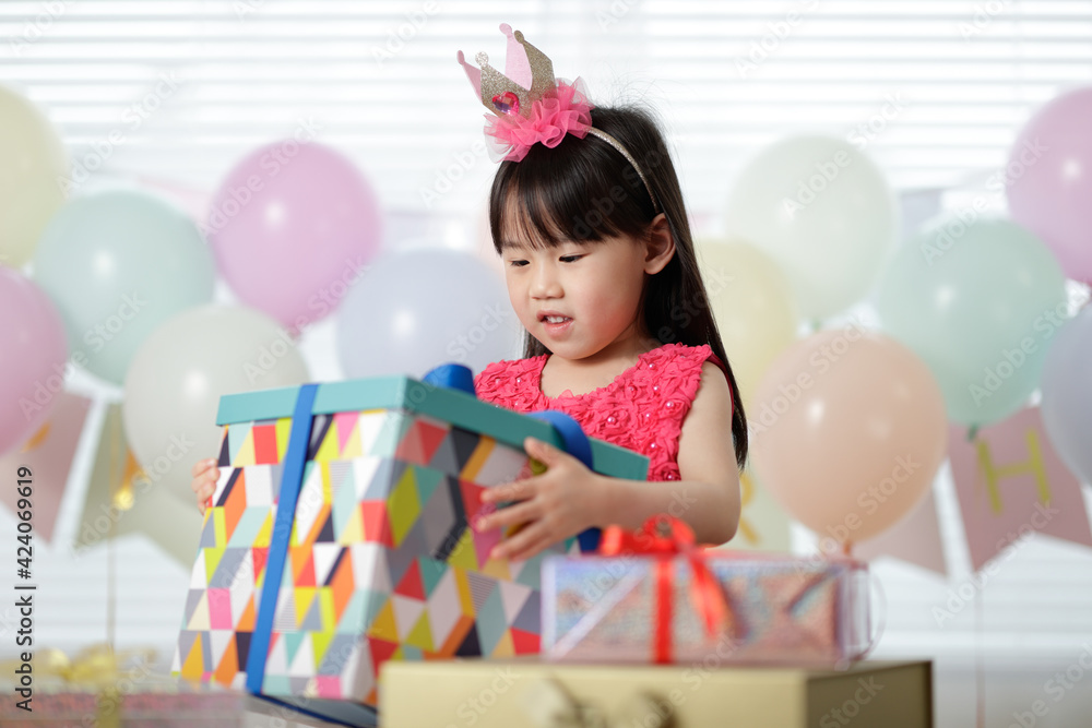 young girl celebrating her 5th birthday at home young girl celebrating her 5th birthday at home