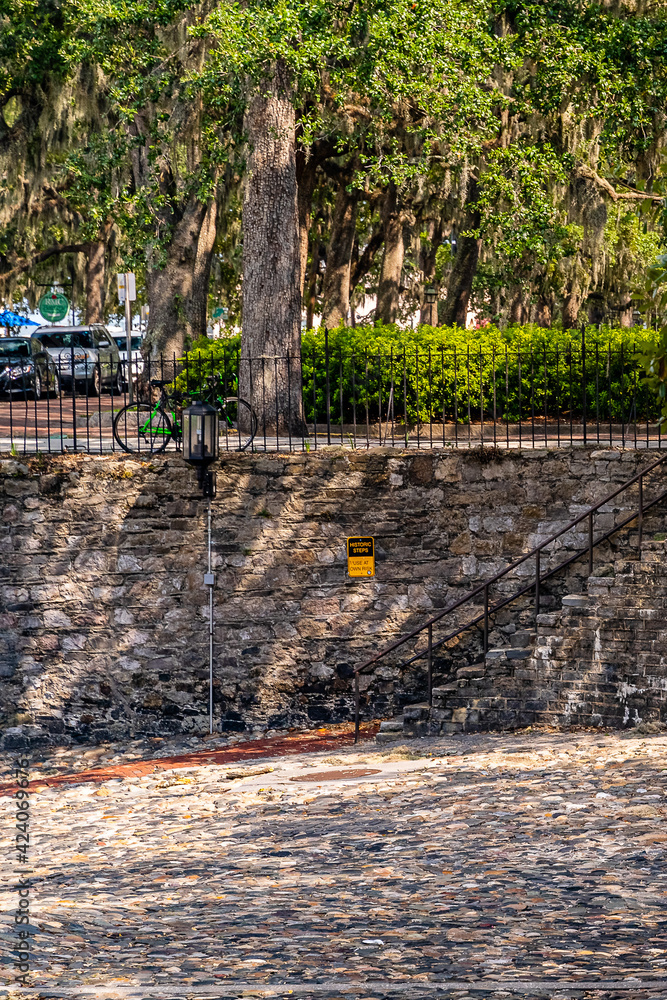 Beautiful streets and homes in downtown Savannah, stone wall, Georgia, USA