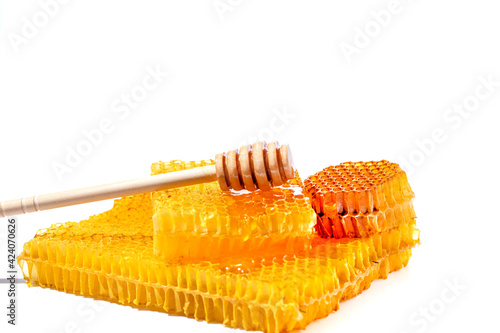 Honey dipper and bowl of honey isolated on white background. Natural bee Honey