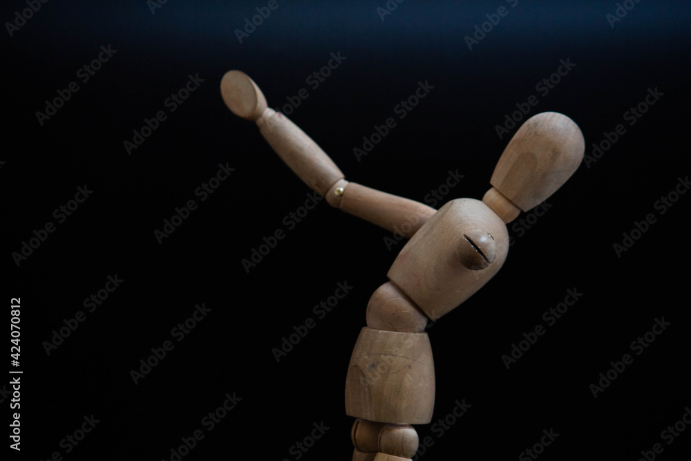 poses of a wooden man for drawing on a black background poses of a wooden man for drawing on a black background