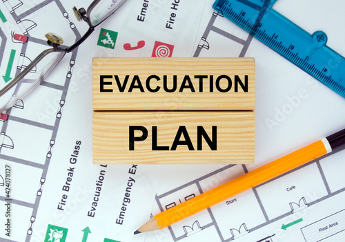 Wooden blocks with text Evacuation Plan Architectural design, sketch, drawing paper, drawings, simple pencil.