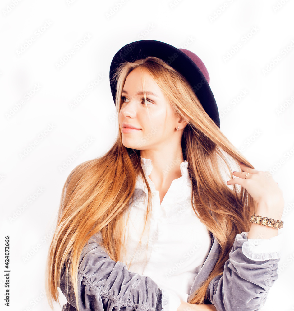 young pretty teenage girl in hat posing cheerful happy smiling on white background, lifestyle people concept