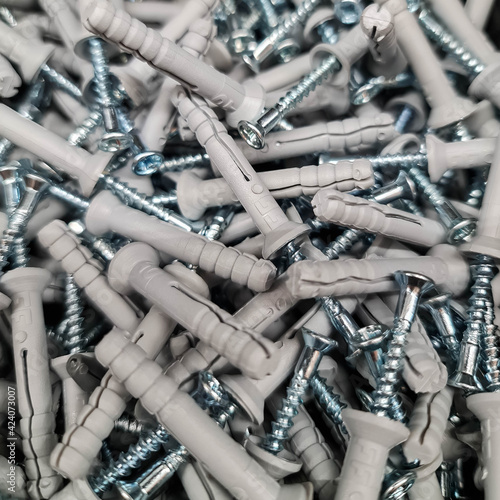 Wall plugs. Screws and dowels isolated as background