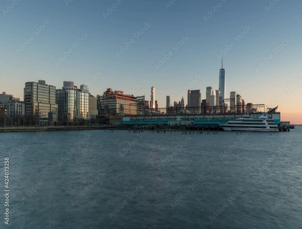 Downtown Manhattan from Hudson river in day to night time lapse Downtown Manhattan from Hudson river in day to night time lapse
