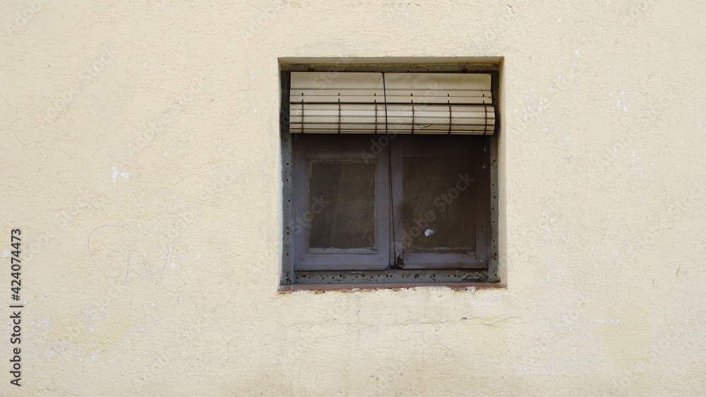 old dirty window with roller shutter