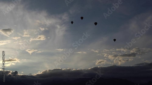 Wallpaper Mural Balloons fly across the sky. A silhouette. Over the mountains. Sunrise. Clouds over the mountains. The general plan. Lots of little balls Torontodigital.ca