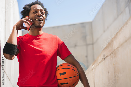 Athlete man talking on the phone.