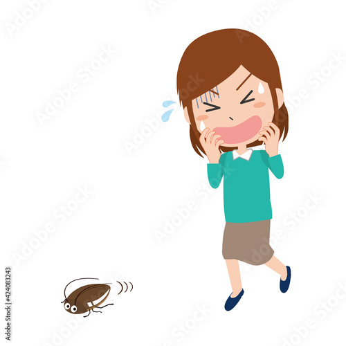 害虫のゴキブリに驚く女性